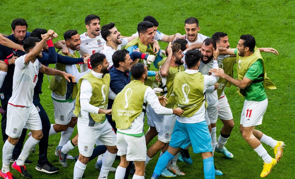 221125 Rouzbeh Cheshmi of Iran celebrates with team mates after scoring 0 1 during the FIFA World Cup, WM, Weltmeisters
